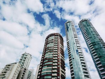 Low angle view of modern buildings against sky