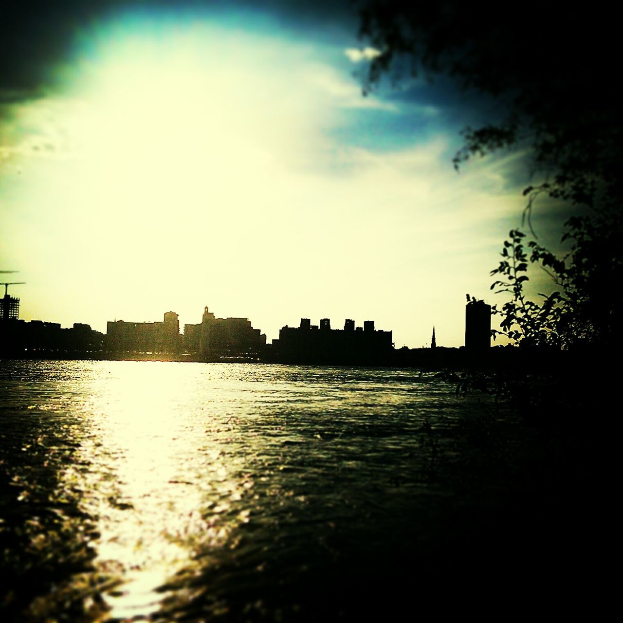 water, waterfront, sky, building exterior, built structure, architecture, silhouette, reflection, rippled, river, sunset, city, tranquility, cloud - sky, dusk, scenics, lake, tranquil scene, cloud, nature