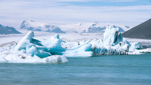 Scenic view of frozen sea against sky