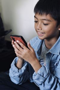 Boy using mobile phone