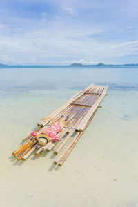 High angle view of deck chairs on beach against sky