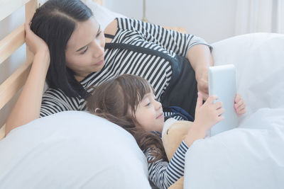 Low angle view of woman using mobile phone