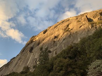 Low angle view of rock formations against sky