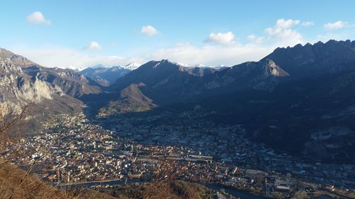 High angle view of townscape and mountains against sky