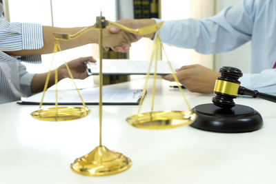 Low section of people standing on table