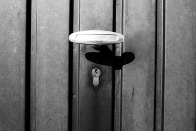 Close-up of doorknob over keyhole