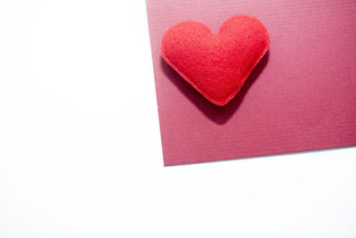 Close-up of heart shape on red background