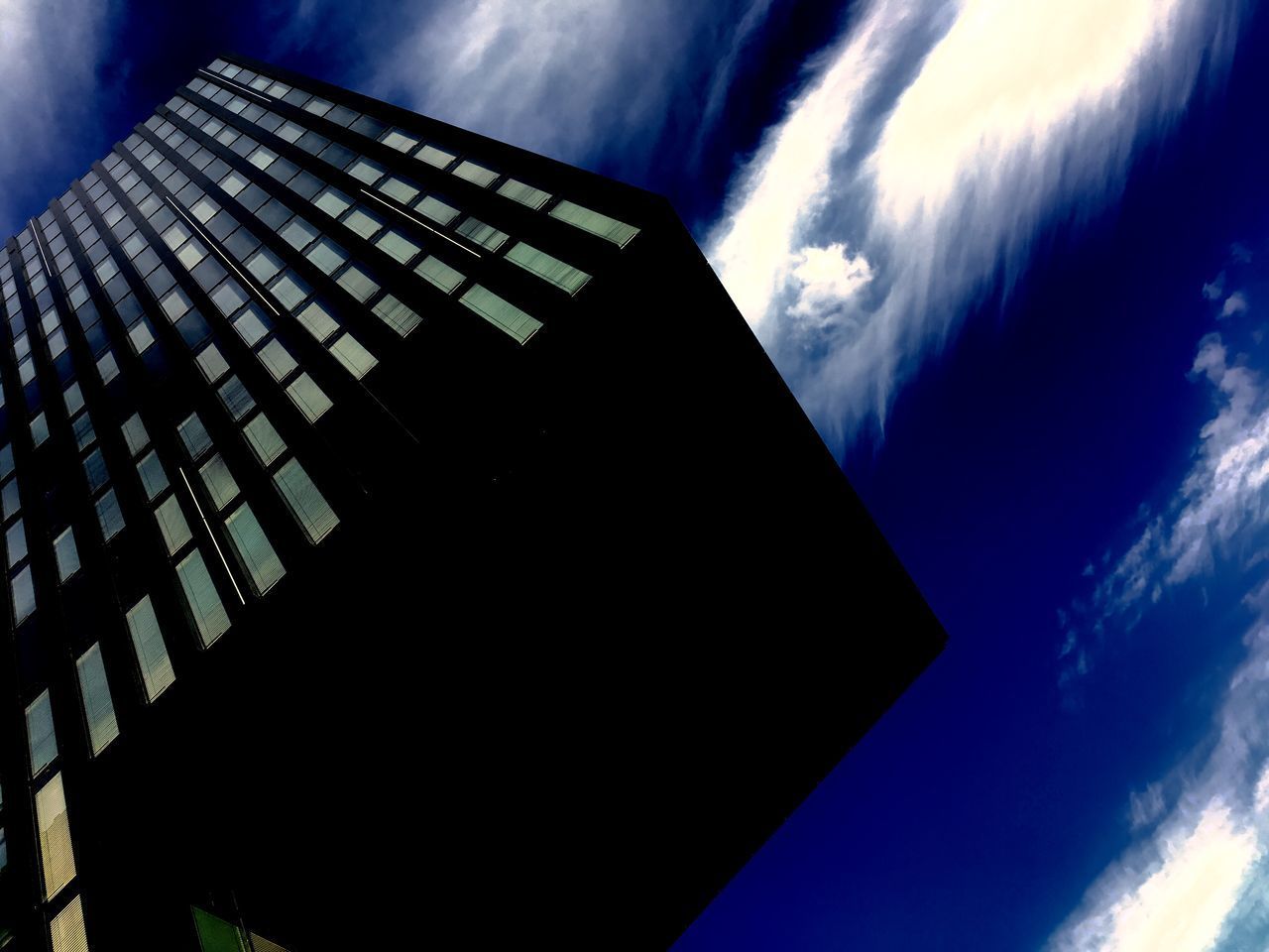 LOW ANGLE VIEW OF MODERN BUILDINGS AGAINST SKY