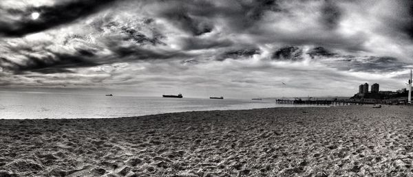 Scenic view of sea against cloudy sky