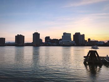 View of boats in river at sunset