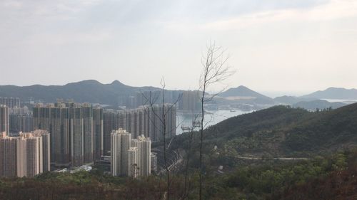 Panoramic view of buildings in city against sky