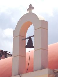 Low angle view of bell tower against sky