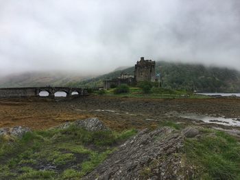 Eilean donan castle, scotland, highlands, historic building against sky