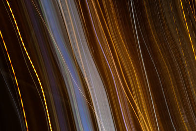 Full frame shot of light trails against sky at night