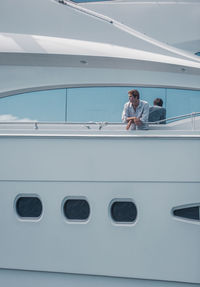 Man with umbrella on boat