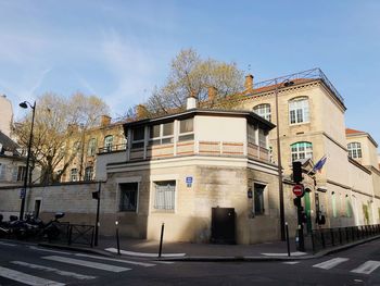 Building by street against sky