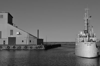 Ship in sea against clear sky