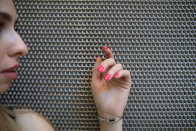 Close-up of woman against wall