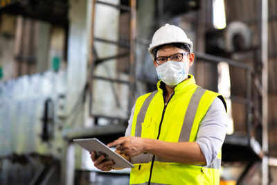 Portrait of man working on mobile phone