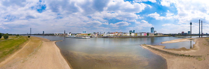 Panoramic view of sea against sky in city