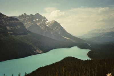 Scenic view of lake and mountains against sky