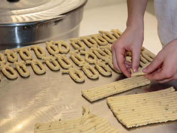 Midsection of person preparing food on table