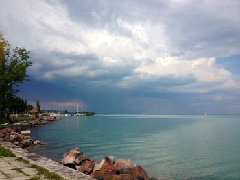 Scenic view of sea against cloudy sky