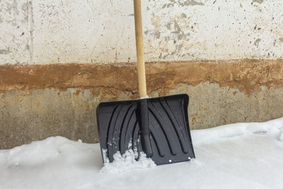 Chair on snow covered wall