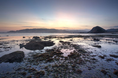 Scenic view of sea against sky during sunset