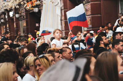 Group of people at street market in city