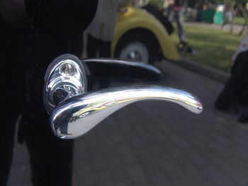 Close-up of bicycle on street