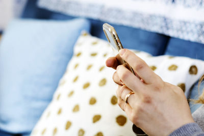 Close-up of hand holding cigarette