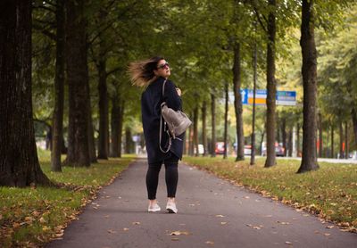 Woman on road in forest