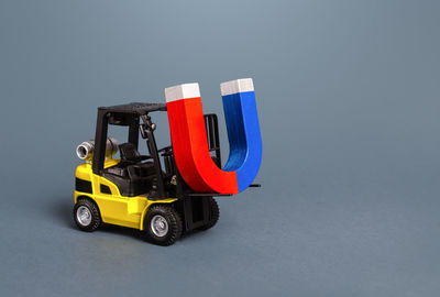 Close-up of toy car against blue background