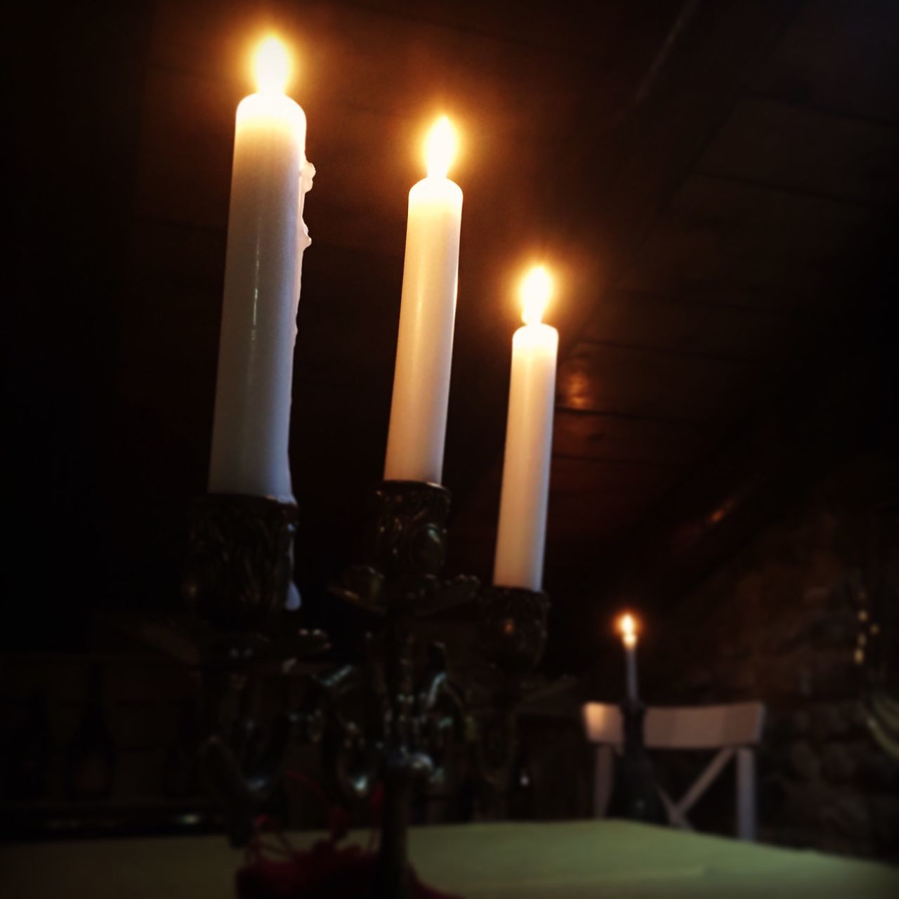 illuminated, candle, flame, indoors, burning, glowing, night, lit, heat - temperature, close-up, lighting equipment, fire - natural phenomenon, religion, candlelight, light - natural phenomenon, spirituality, selective focus, focus on foreground, dark, no people