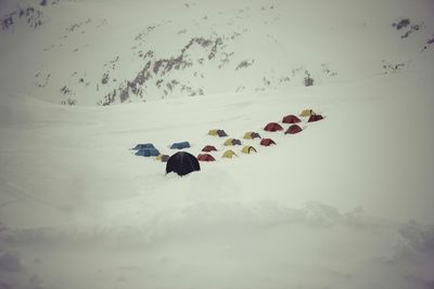 People on snow covered landscape