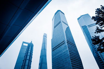 Low angle view of modern buildings against sky