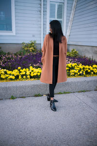 Full length of woman walking on street