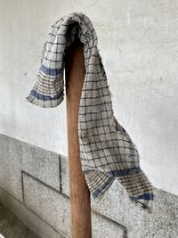 A washcloth hanging over a pole