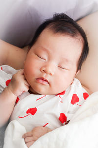 Cute baby sleeping on bed