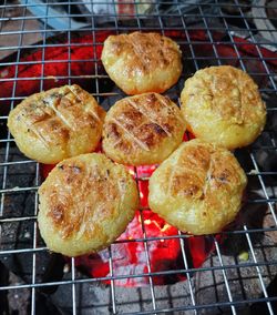 High angle view of meat on barbecue grill