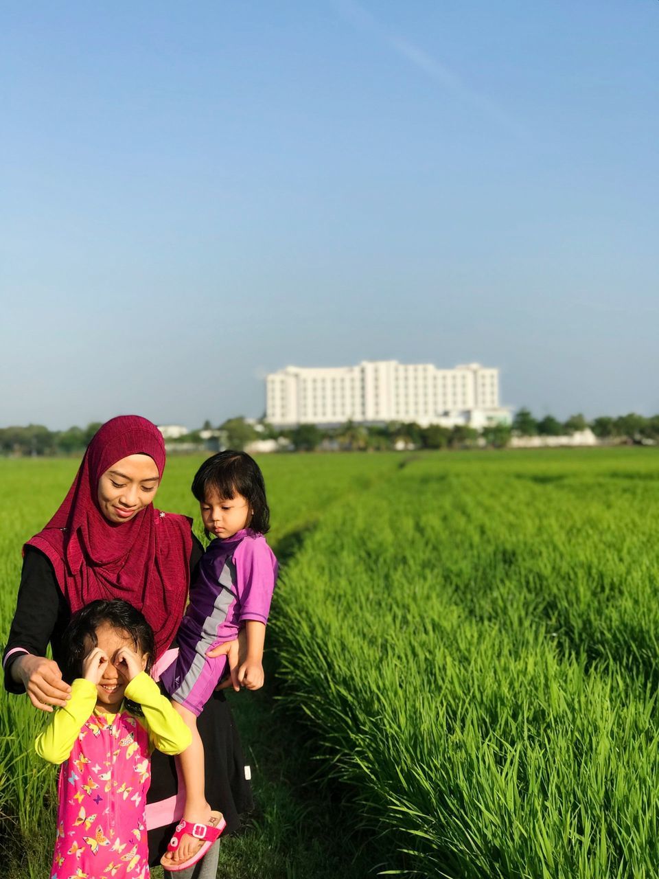 family, child, childhood, women, girls, females, group of people, togetherness, sky, grass, plant, nature, parent, boys, bonding, men, daughter, sister, innocence