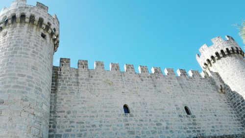 Low angle view of fort against clear sky