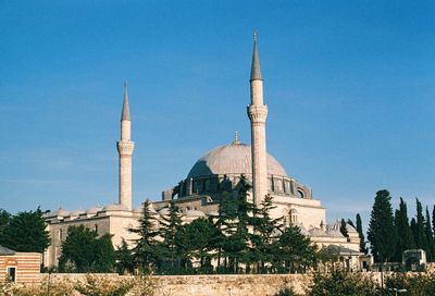 Mosque against clear blue sky