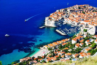 High angle view of city by sea