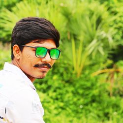 Portrait of young man wearing sunglasses