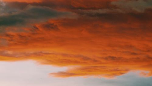 Low angle view of dramatic sky during sunset