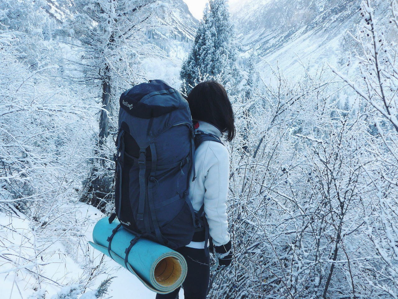 cold temperature, winter, snow, lifestyles, leisure activity, season, men, standing, rear view, low section, weather, high angle view, covering, shoe, day, unrecognizable person, frozen, outdoors