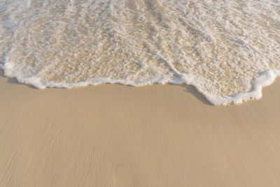 High angle view of surf on beach