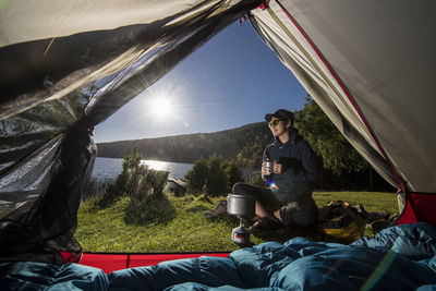 Woman camping at the chilean lake district, pucon, chile